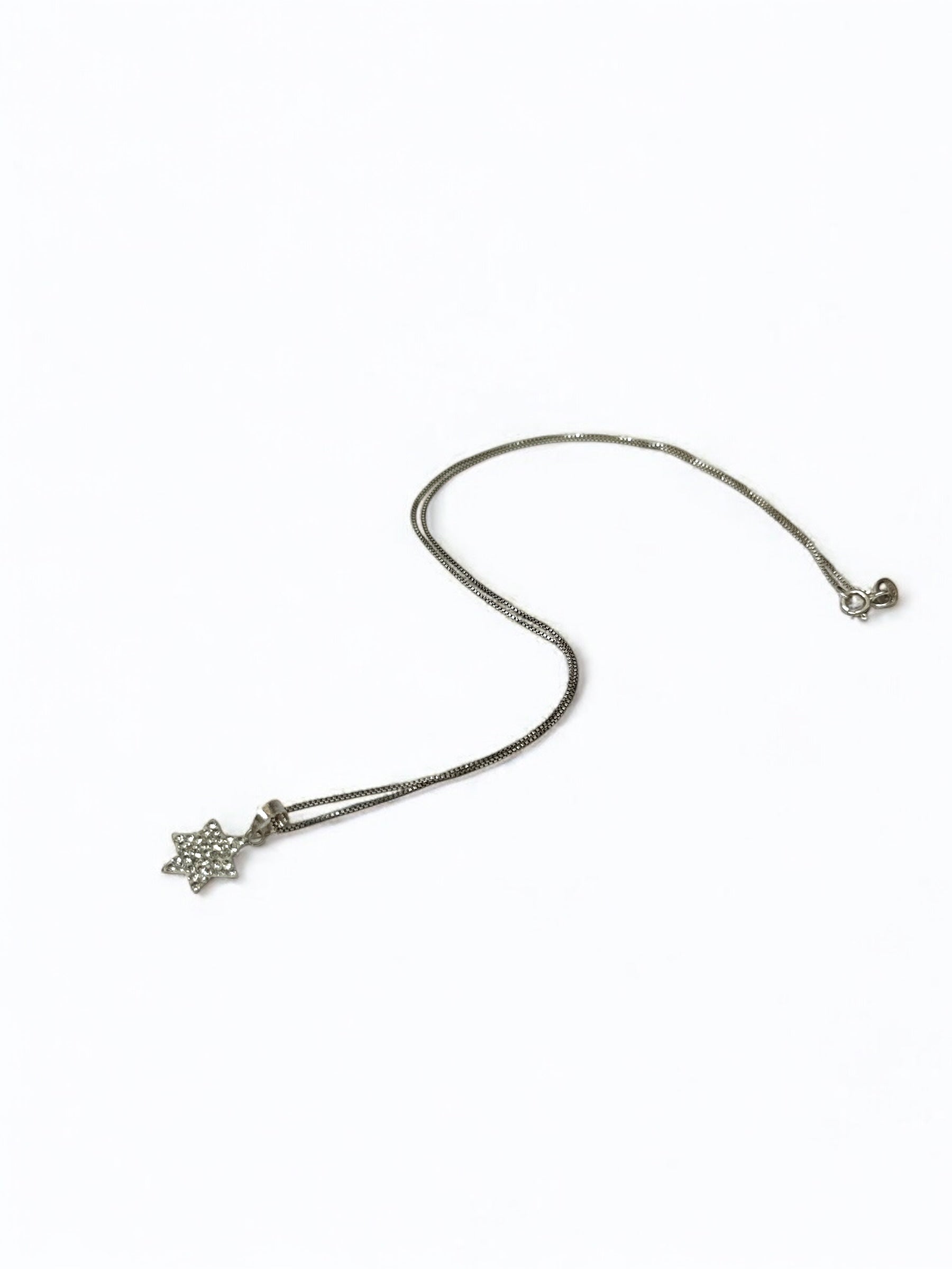 Close-up of sparkling crystal on Star of David pendant
