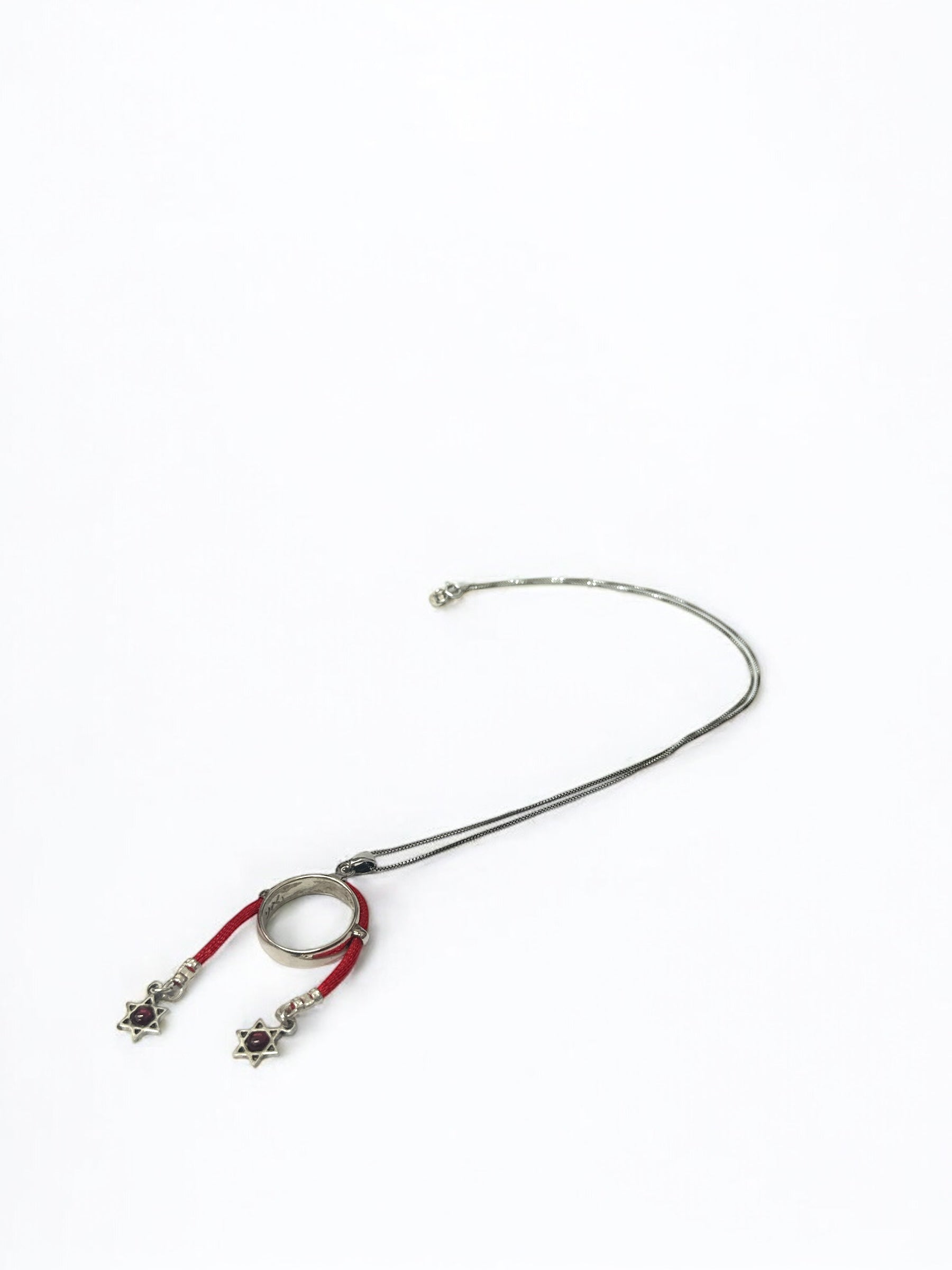 Close-up of Star of David charms on marriage blessing pendant
