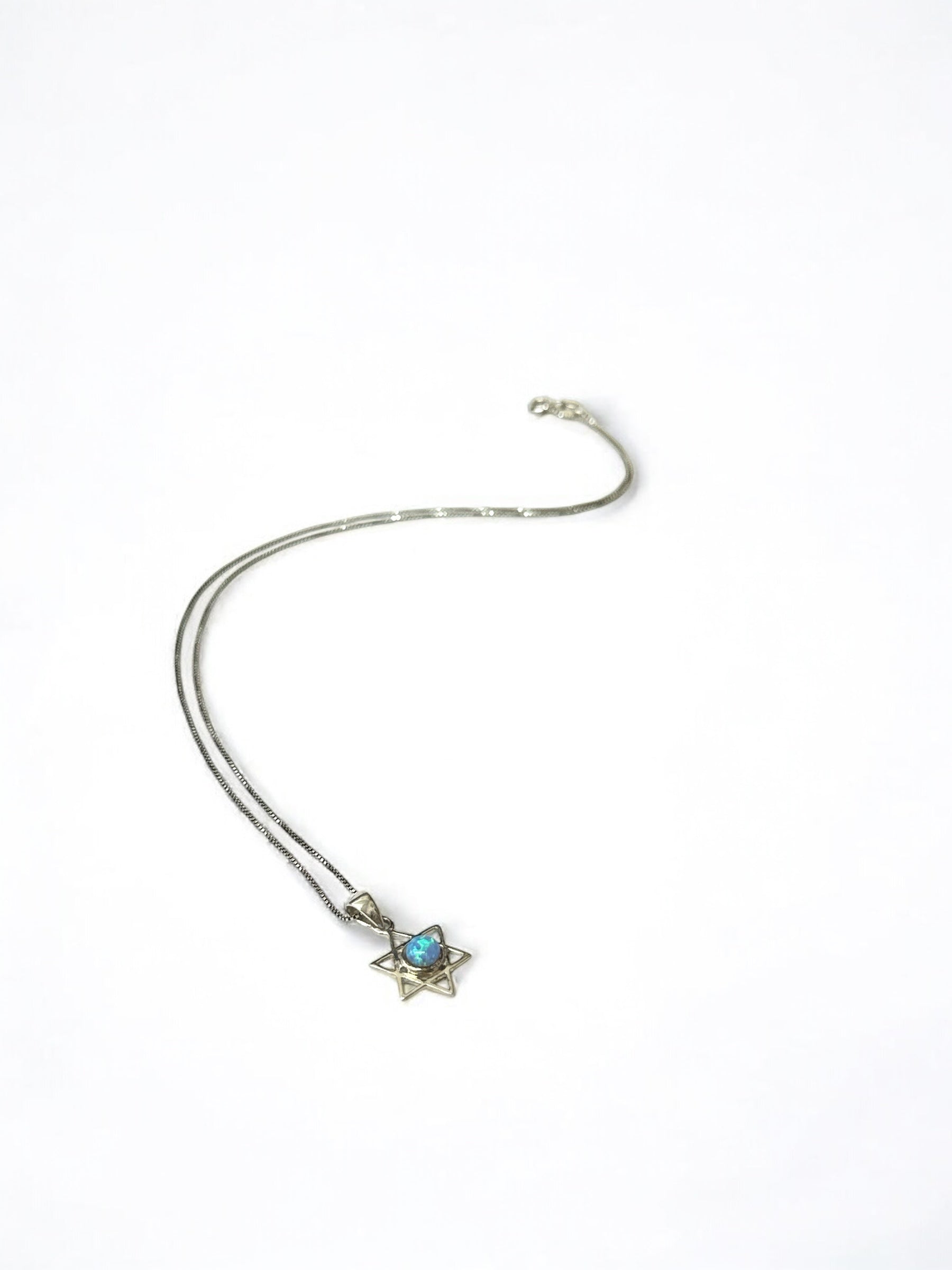 Close-up of opal stone in Star of David pendant
