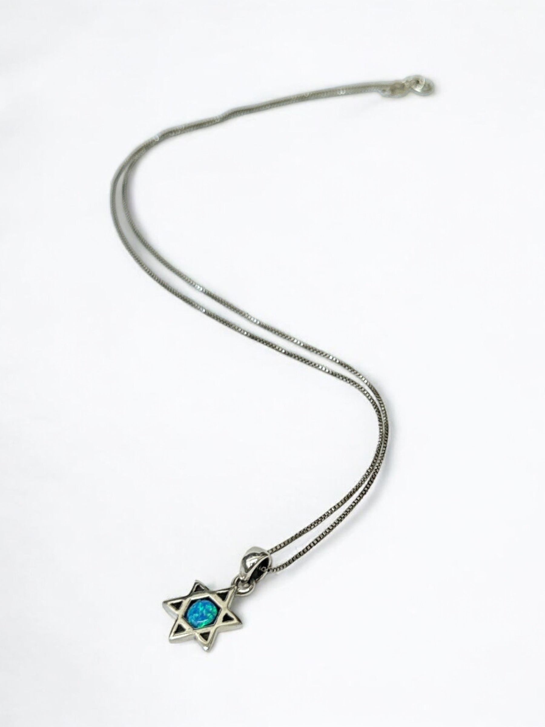 Close-up of opal stone in Star of David pendant, alternate variant