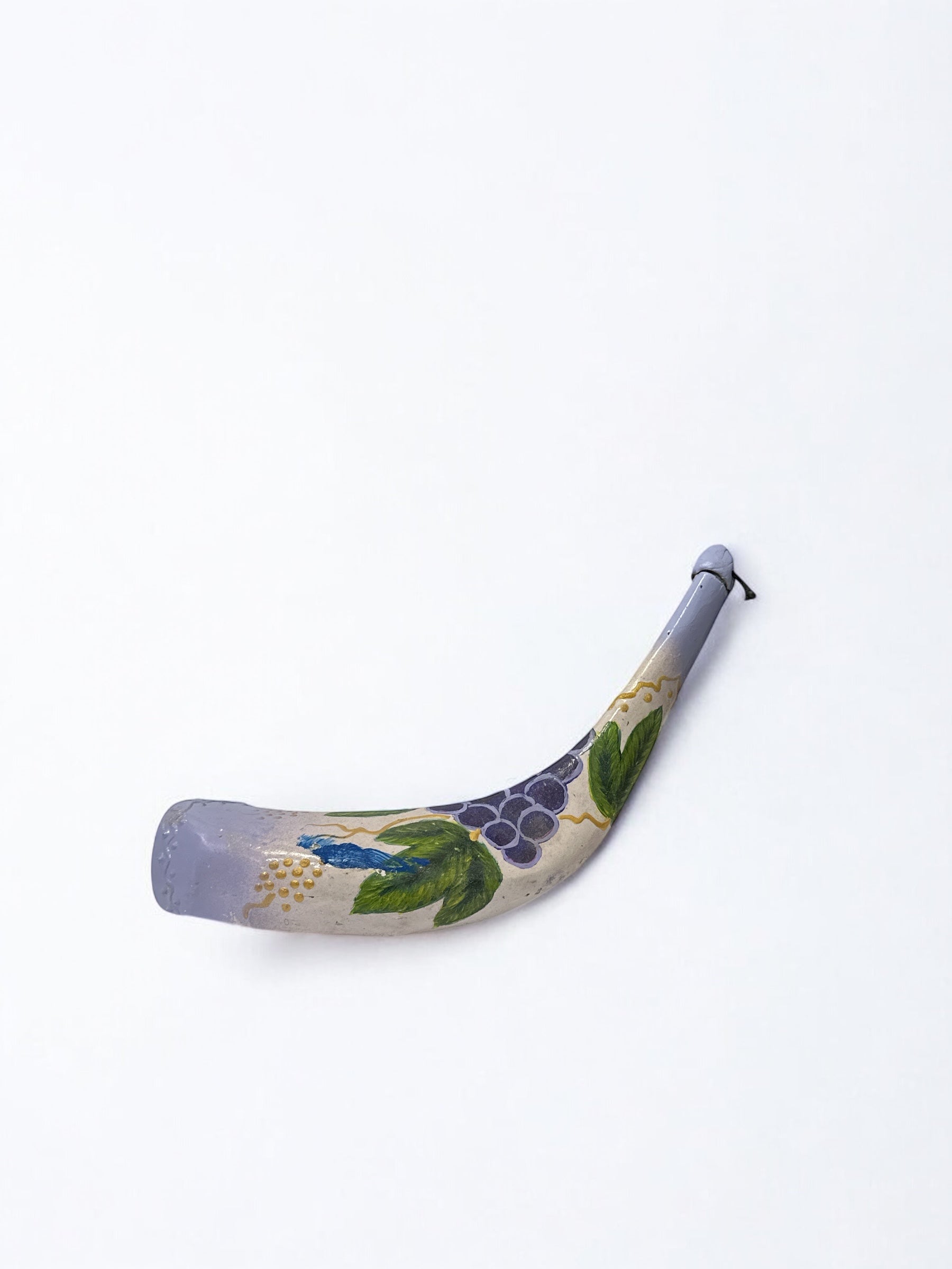 Close-up of Seven Species artwork on decorative shofar bottle